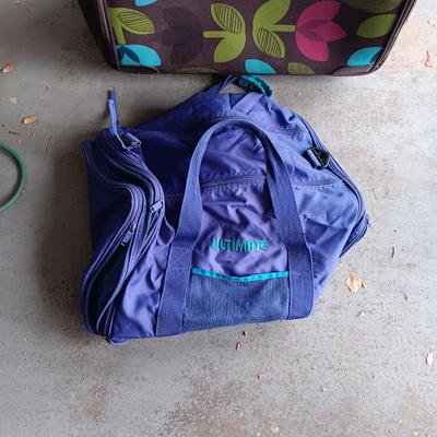 LARGE CLOTH SUITCASE ON 2 WHEELS AND A SMALLER DUFFLE BAG