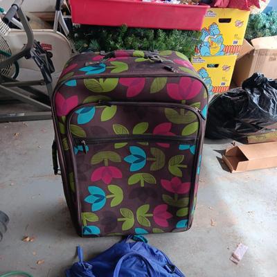 LARGE CLOTH SUITCASE ON 2 WHEELS AND A SMALLER DUFFLE BAG