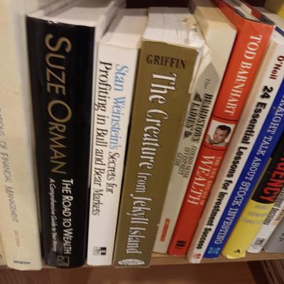 A LARGE COLLECTION OF BOOKS WITH VARIOUS SUBJECTS