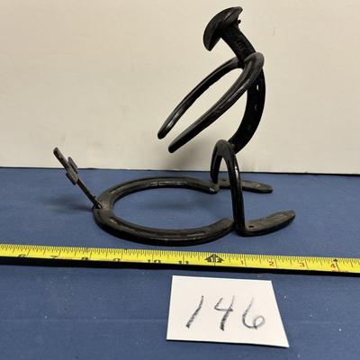 Horse Shoe Kneeling Cowboy