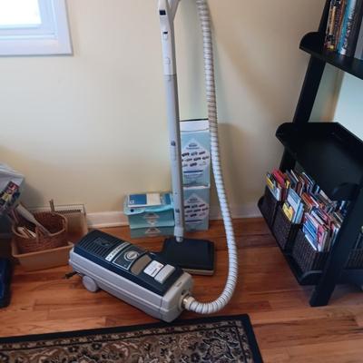 ELECTROLUX CANISTER VACUUM W/RETRACTABLE CORD, MANY BAGS AND FILTERS