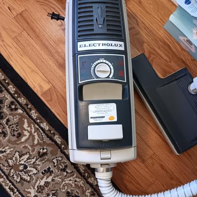ELECTROLUX CANISTER VACUUM W/RETRACTABLE CORD, MANY BAGS AND FILTERS