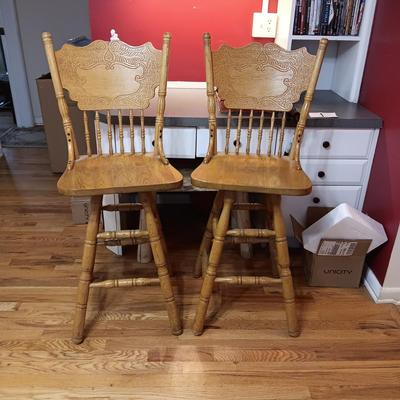 2 SWIVEL OAK BAR STOOLS