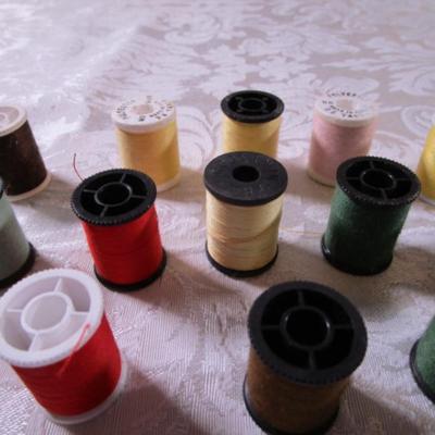 24 small spools of thread