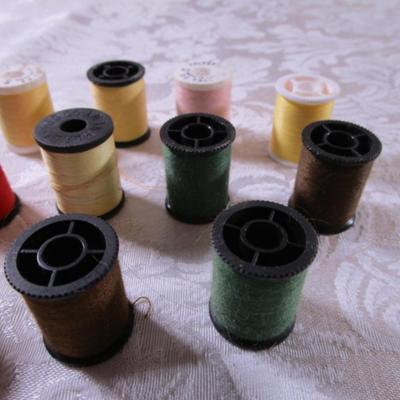 24 small spools of thread
