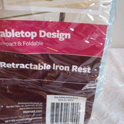 Folding tabletop ironing board with cover