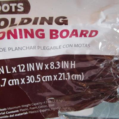 Folding tabletop ironing board with cover