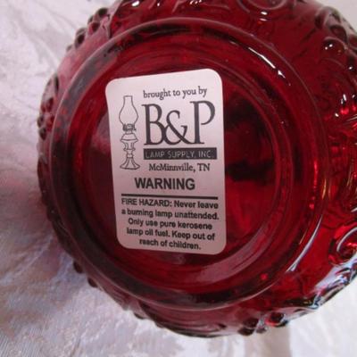 Small red glass oil lamp