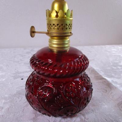 Small red glass oil lamp