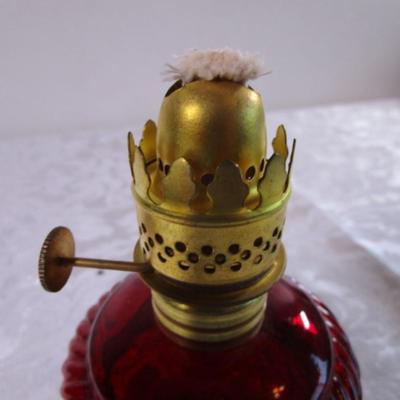 Small red glass oil lamp