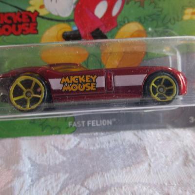 2 Hot Wheels cars, 1 Mickey Mouse, 1 Taz