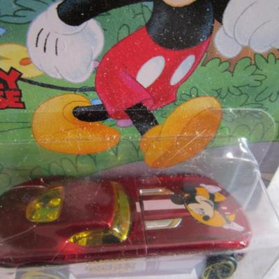 2 Hot Wheels cars, 1 Mickey Mouse, 1 Taz