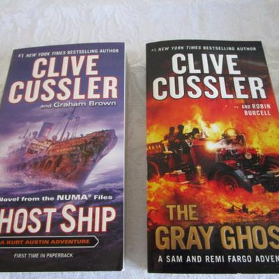 2 Clive Cussler novels, paperback