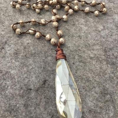 Beautiful faceted glass bead, necklace, and crystal pendant