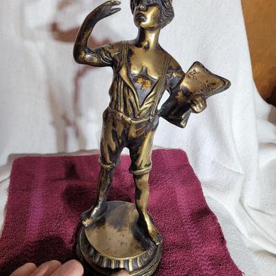 Bronze sculpted paperboy
