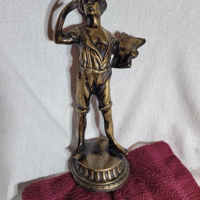 Bronze sculpted paperboy