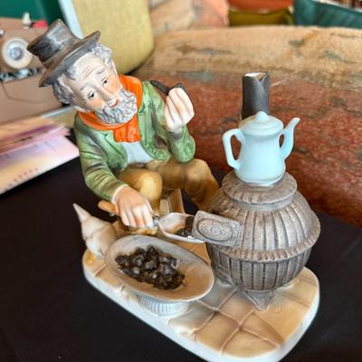 2 Ceramic figures - 1 metal worker guy & guy w/fireplace