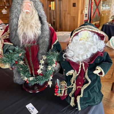 2 Christmas themed dressed up Santa figures