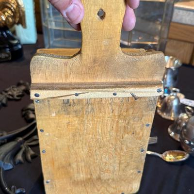 Vintage cheese grater attached to wood box
