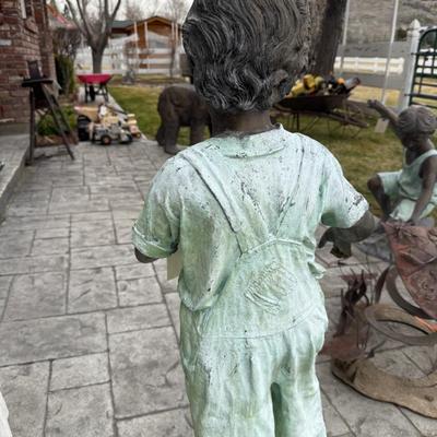 Bronze boy in Overalls 40”t life-sized outdoor statue