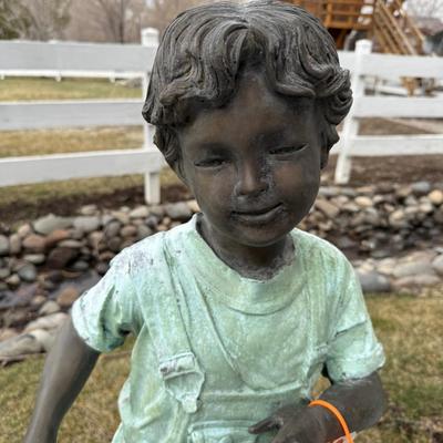 Bronze boy in Overalls 40”t life-sized outdoor statue