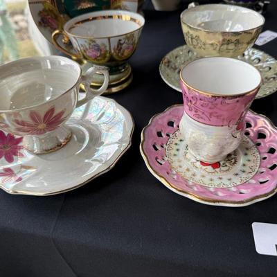 assortment of 7 ceramic teacups & matching saucers