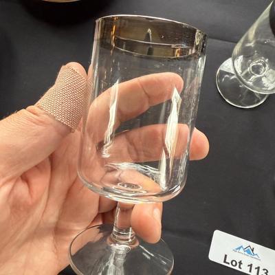 Set of 7 clear bar glasses w/silver chrome top rim