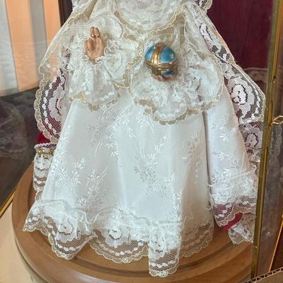 Religious themed Doll in mirrored back Display
