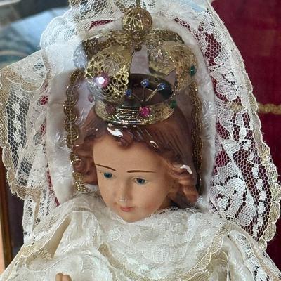 Religious themed Doll in mirrored back Display