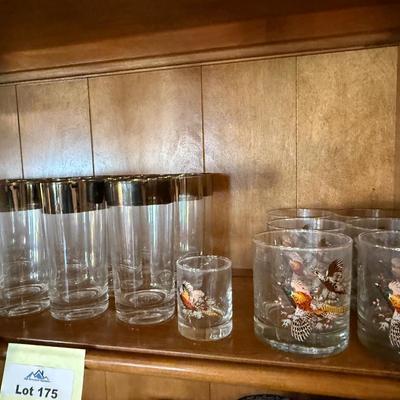 Top shelf of Vintage silver top rimmed Barware Glasses