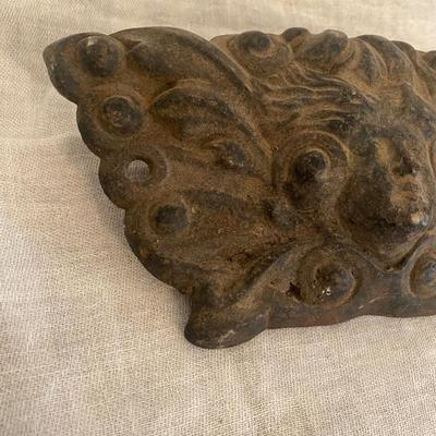 Figural Cast Iron Embossed Cherub