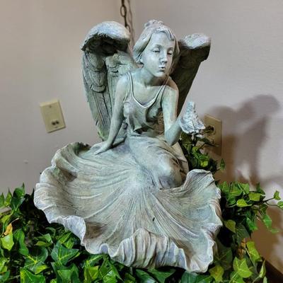 Large pot and statue.