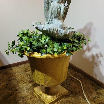 Large pot and statue.