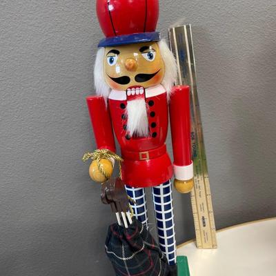 Golfer and beer drinking nut cracker