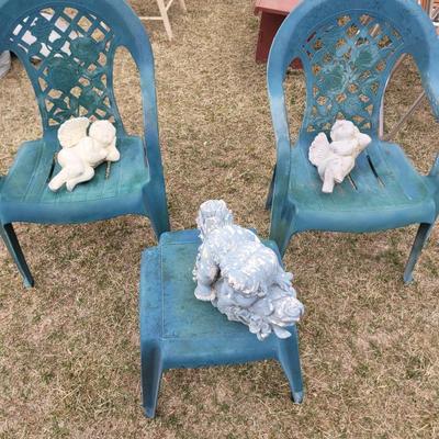 2 patio chairs, table, 2 angels and a cherub