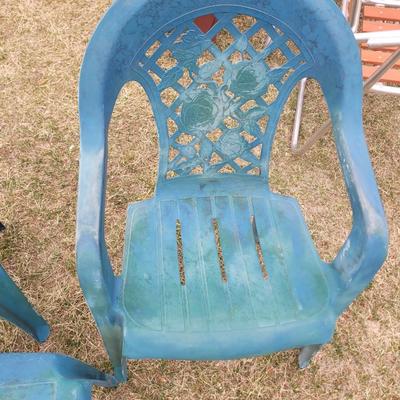 2 patio chairs, table, 2 angels and a cherub