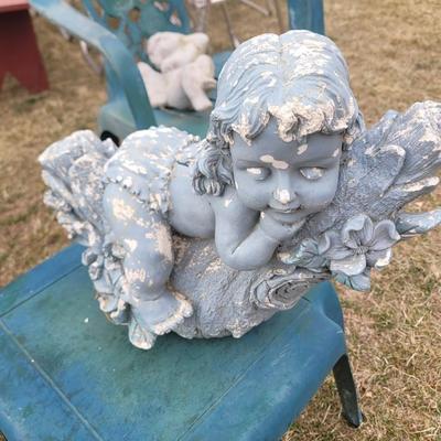 2 patio chairs, table, 2 angels and a cherub