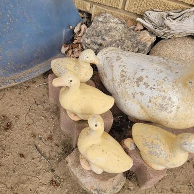Concrete ducks and 3 babies