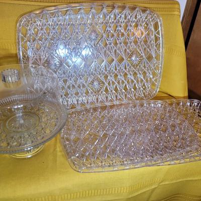 3 serving trays and a crystal based cake presenter