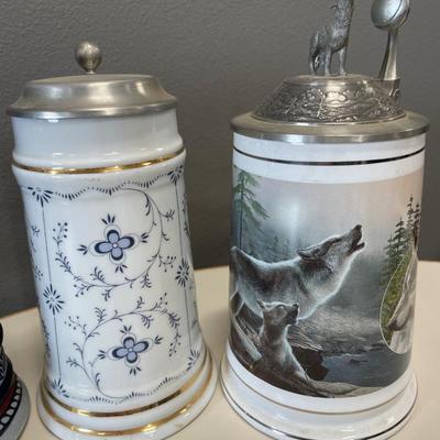 2 Avon steins & wolf and floral steins