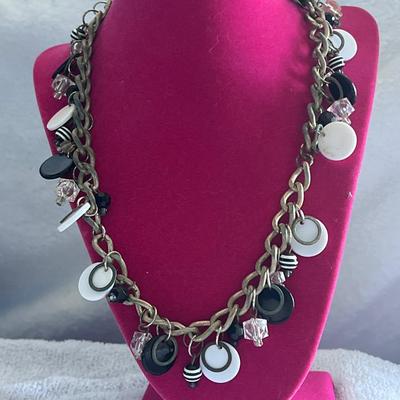 Silver toned black and white charm necklace