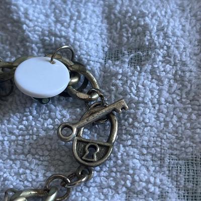 Silver toned black and white charm necklace