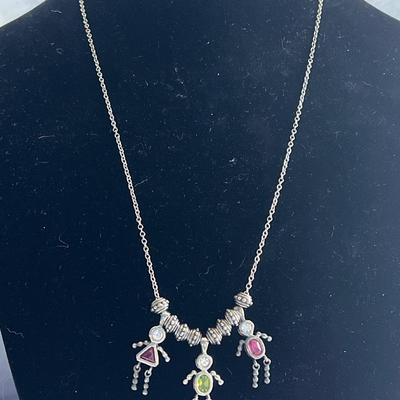 Silver toned long chain necklace with charms