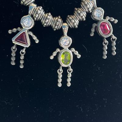 Silver toned long chain necklace with charms