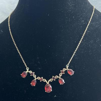 Gold toned ruby jeweled necklace