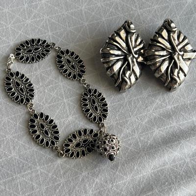 Silver toned black bracelet with silver toned earrings