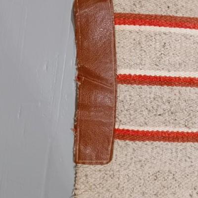 SADDLE BLANKET, WOOL SADDLE PAD AND A CINCH