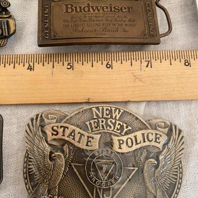 Assortment of Vintage belt buckles including Budweiser