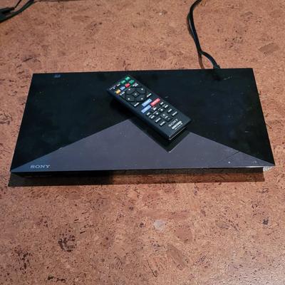 Blue Ray Player, Apple T.V., and Universal Remote (BC-EL)