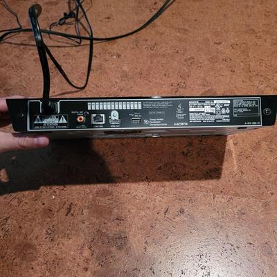 Blue Ray Player, Apple T.V., and Universal Remote (BC-EL)